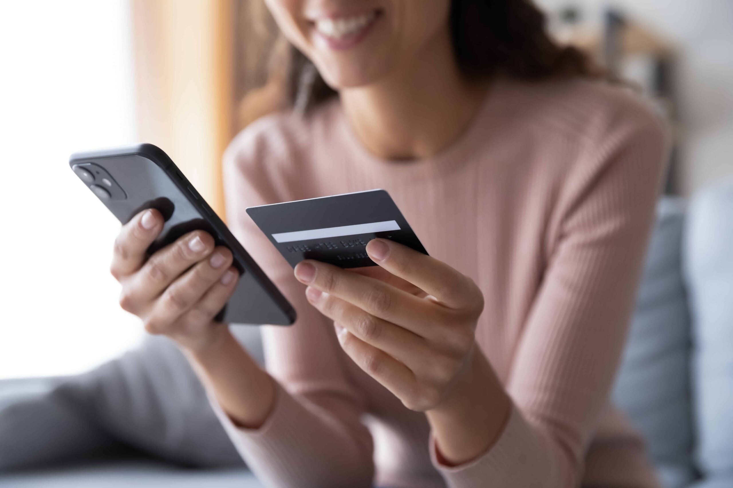 Woman using her phone to make payment